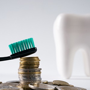 Toothbrush on a stack of coins